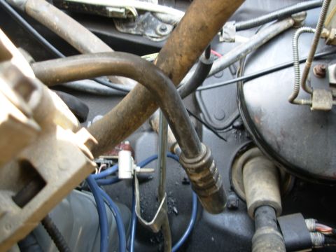 1994 Ford Bronco - The coil support brace couldn't be reinstalled, but since the dipstick was also loose, its brace was bent up to meet the bracket solving bo…