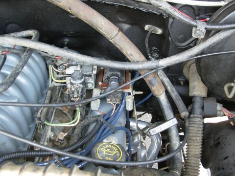 1994 Ford Bronco - The coil support brace couldn't be reinstalled, but since the dipstick was also loose, its brace was bent up to meet the bracket solving bo…