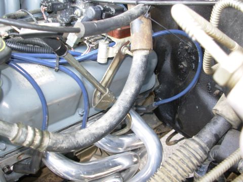 1994 Ford Bronco - The coil support brace couldn't be reinstalled, but since the dipstick was also loose, its brace was bent up to meet the bracket solving bo…
