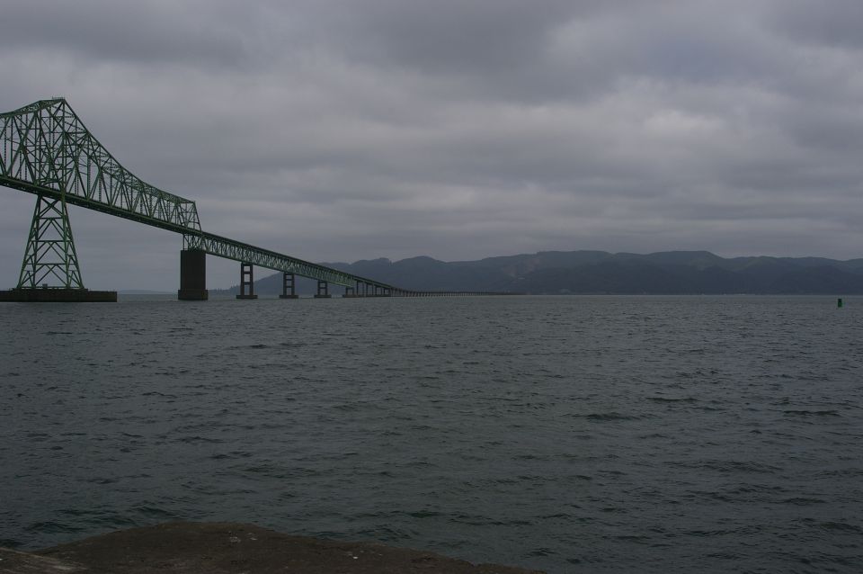 Astoria-Megler Bridge spans Columbia River under cloudy sky