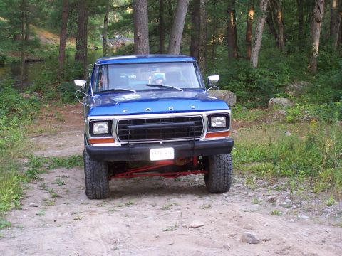 1979 Ford Bronco - Front view of a blue 1979 Ford Bronco with a black grille and chrome accents.