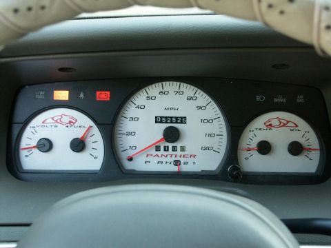 2001 Mercury Grand Marquis - Custom gauge cluster a panther logo and a speedometer that reads 0 mph, with an odometer displaying 052525.