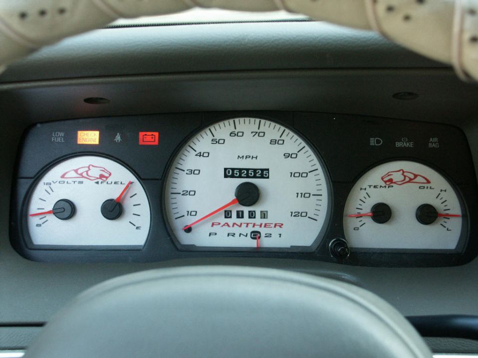 White-face Panther gauge cluster with cougar logos, 120-mph speedometer reading 52,525 miles