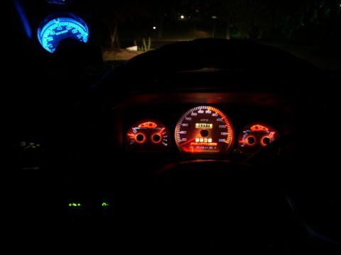 2001 Mercury Grand Marquis - Custom gauge overlays illuminate the dashboard of a car at night, with the speedometer displaying 80 mph.