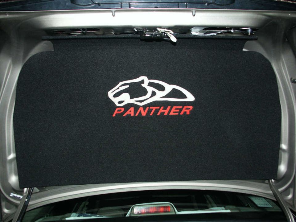 Trunk liner with white panther logo and red "PANTHER" text