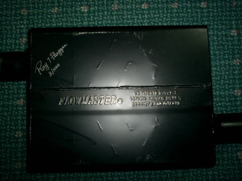2003 Mercury Marauder - A Flowmaster muffler is shown, "Ray J. Flugger 3/1000" and patent information stamped on its surface.