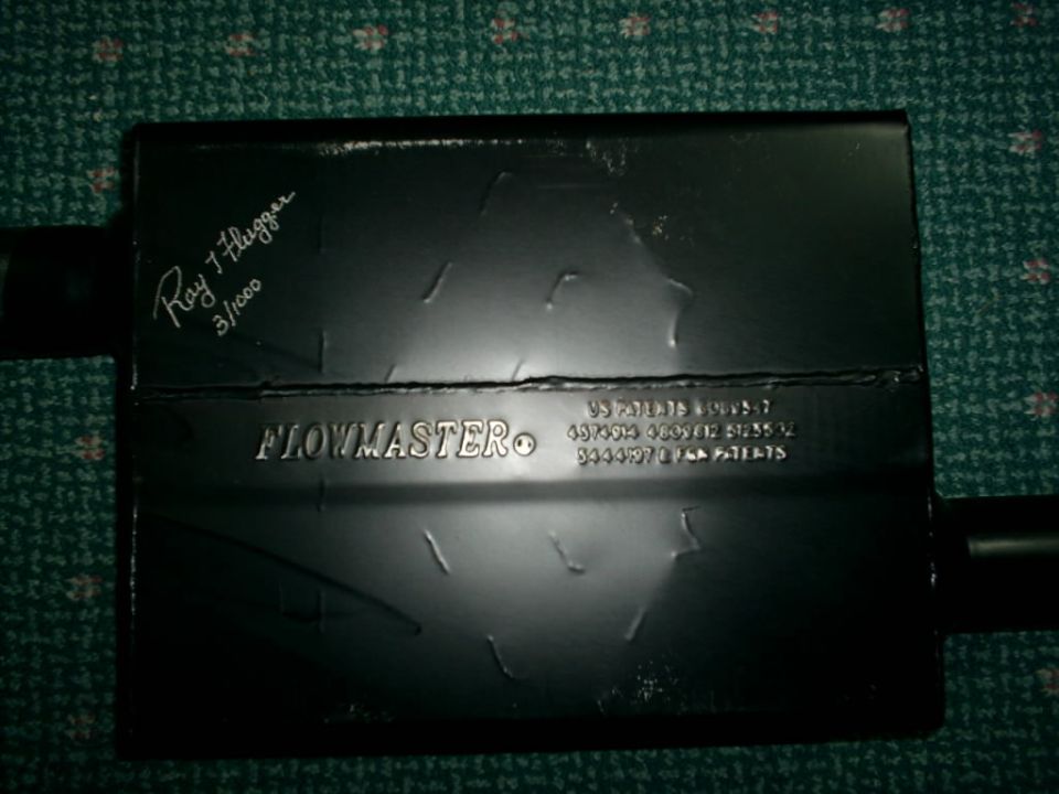 Flowmaster muffler with "Ray J. Flugger 3/1000" and patent numbers