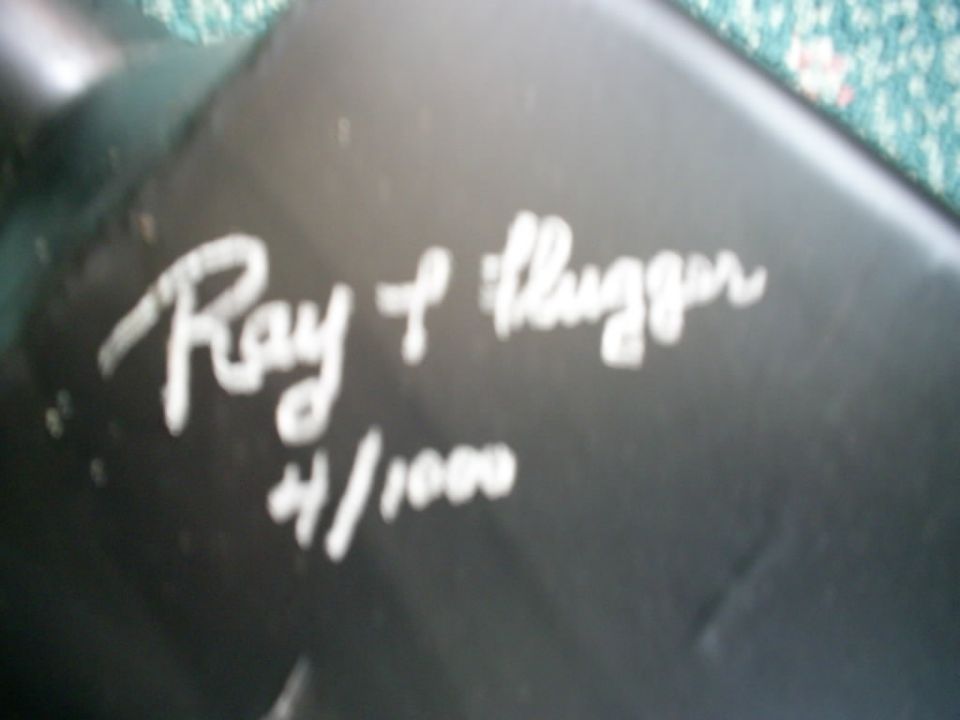 Black car part with white text 'Ray & Flugger 4/1000' and Supermotors logo