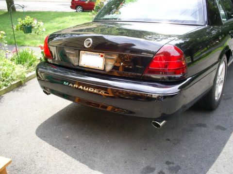 2003 Mercury Marauder - Rear view of a black 2003 Mercury Marauder, showing the distinctive Marauder badging on the bumper.