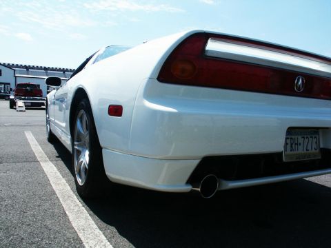 2001 Mercury Grand Marquis - A white Acura NSX is seen from the rear quarter panel, with a license plate visible.