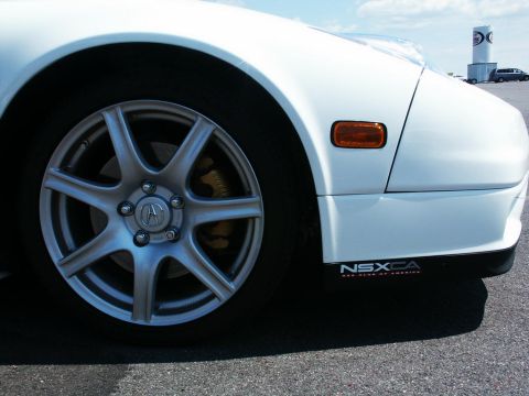 2001 Mercury Grand Marquis - Close-up of a white Acura NSX's front wheel and side skirt, showing the NSXCA club logo.