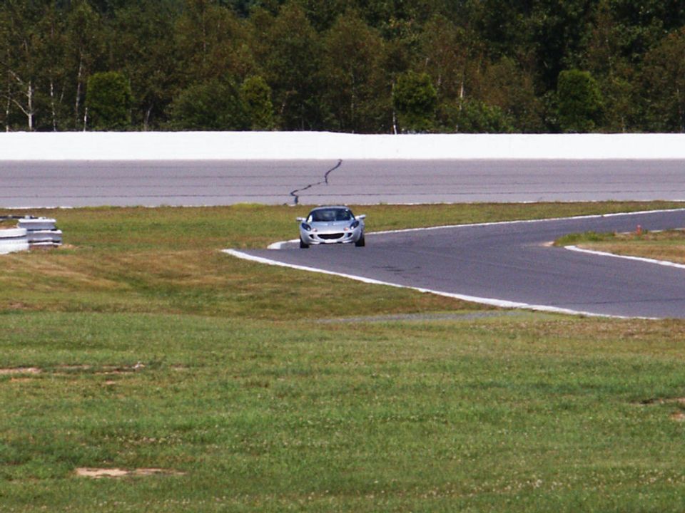 Silver sports car on race track