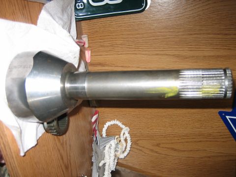 1986 Ford F-150 - Close-up of an axle shaft, identified by the "LONGFIELD" inscription and its splined end.