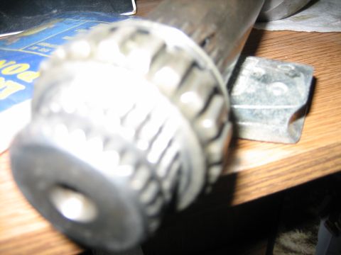 1986 Ford F-150 - A close-up view of a metal gear and shaft assembly, possibly for a vehicle component.
