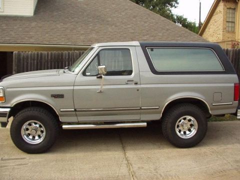 1992 Ford Bronco - New ProComp Xtreme 15x8" rims and 33x12.5x15 All Terrains, and DeeZee stainless nerf bars. Had to install 2" coils and shim the bumper 3/4"…