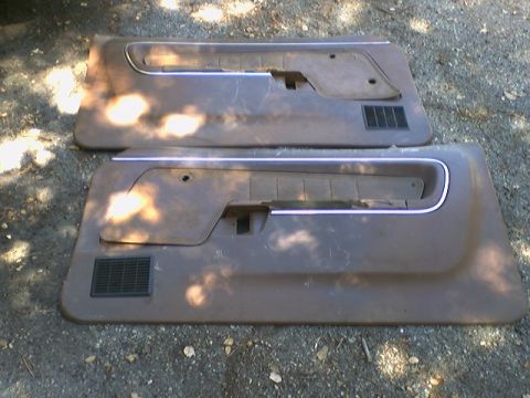 1973 Ford Ranchero - Pair of car door panels shown, likely for a coupe or sedan, with visible wear and tear.