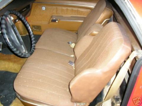 1973 Ford Ranchero - The interior of a 1973 Ford Ranchero shows brown fabric seats and a tan dashboard.