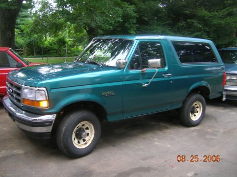 1996 Ford Bronco - A teal 1996 Ford Bronco is parked next to another vehicle, with a date stamp of 08.25.2006 visible.