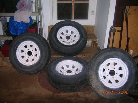 1996 Ford Bronco - Four tires with white rims are shown indoors, with a date stamp of 08.25.2006 visible.