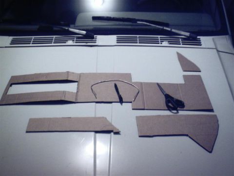 1987 Ford Bronco - Basics. Here you see some of the cardboard templates, scissors, a pen, and some silver solder (also known as a redneck contour gauge)
