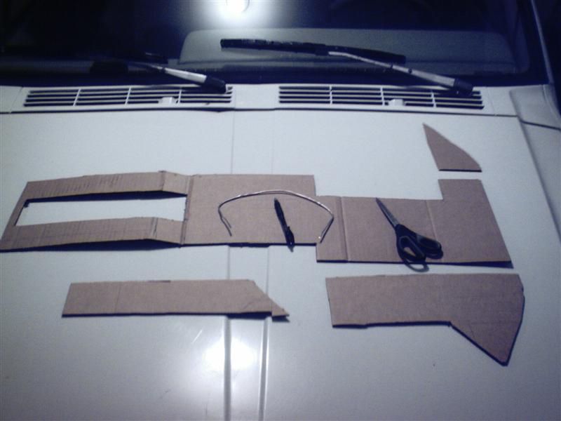 Basics. Here you see some of the cardboard templates, scissors, a pen, and some silver solder (also known as a redneck contour gauge)