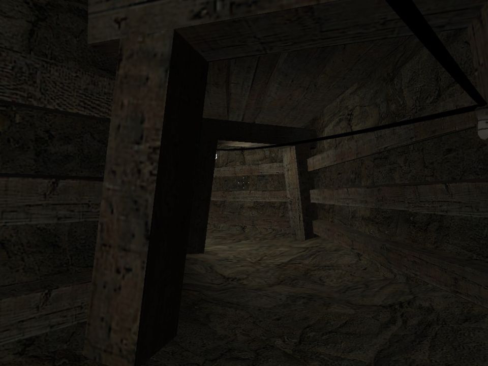 Interior of a dark, wooden mine shaft with support beams and rough wooden walls