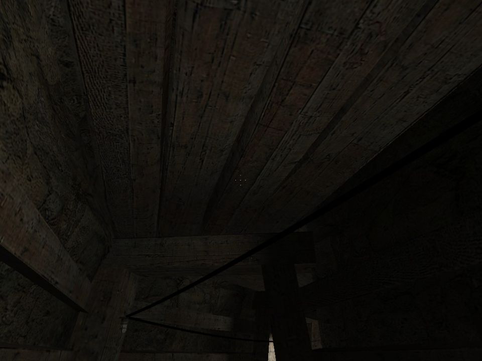 Dark wooden interior with beams and planks, a black cable, and a Supermotors logo in the lower right corner