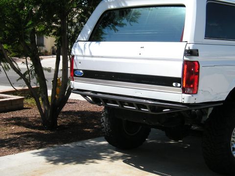 1993 Ford Bronco - White 1993 Ford Bronco rear view a custom tube bumper and off-road tires.