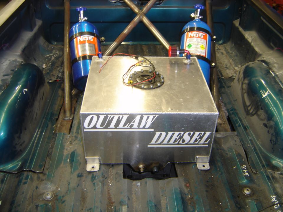 Outlaw Diesel aluminum fuel cell and two NOS nitrous bottles mounted in a teal pickup bed