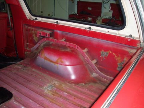 1978 Ford Bronco - The cargo area of a 1978 Ford Bronco shows significant rust on the wheel well and floor panels.