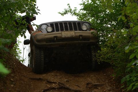2006 Jeep Liberty - A Jeep Liberty navigates a steep, wooded trail.