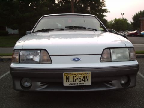 1989 Ford Mustang - Front view of a white 1989 Ford Mustang, identified by its distinctive body style and grille.