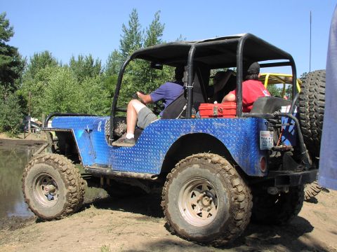 1979 Ford Bronco - This modified Jeep is equipped for off-road adventures, with large tires and a sturdy roll cage.