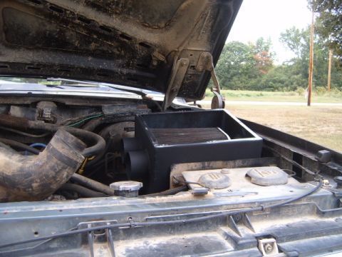 1988 Ford Bronco - Engine bay of a 1988 Ford Bronco with an aftermarket air intake installed.