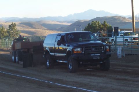 1994 Ford F-150 - Ford F-Series truck competes in a pull event, with a second truck in the background.