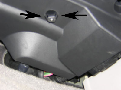 2000 Ford Crown Victoria - You'll want to squeeze the sides on this plastic pin for the lower panel to drop.