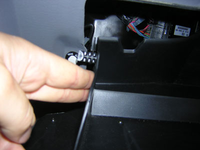 2000 Ford Crown Victoria - Glovebox is easily removed by pushing the sides of the glovebox for these tabs to clear. Oh yeah, I had to remove the Traction control butt…