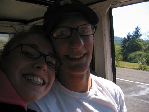 1991 Ford Explorer - Two people smile for a selfie from inside a vehicle, with a scenic view visible through the window.