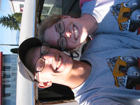 1991 Ford Explorer - Two smiling people wearing graphic t-shirts are pictured in what appears to be a vehicle's interior.