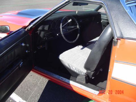 1973 Ford Ranchero - The interior of a 1973 Ford Ranchero reveals its driver's seat, steering wheel, and dashboard details.