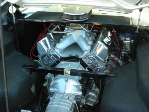 1998 Ford Crown Victoria - supercharged V8 with polished 3V heads, a chrome air cleaner and a roots blower mounted in a custom engine compartment.