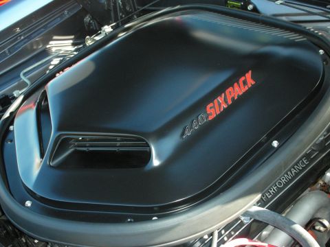 1998 Ford Crown Victoria - black shaker air cleaner stamped 440 Six Pack sits atop the engine of a Mopar muscle car.