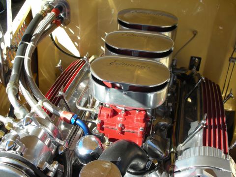 1998 Ford Crown Victoria - polished supercharged V8 with red finned covers and three Edmunds air cleaners in a hot-rod engine bay.