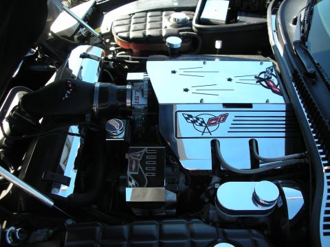 1998 Ford Crown Victoria - C5 Corvette engine bay dressed with polished panels and crossed-flag emblems over the intake.