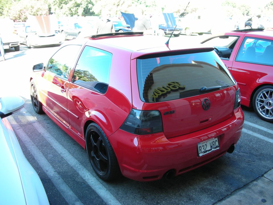 Red Volkswagen Golf R32 hatchback rear three-quarter at a car show
