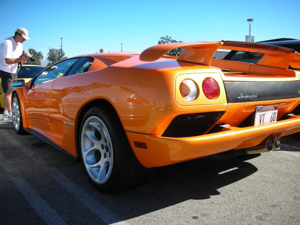 Orange Lamborghini Diablo VT rear three-quarter with round taillights