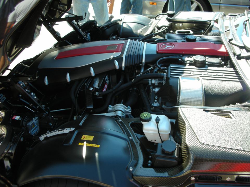 Engine bay of a Dodge Viper showing red Viper valve cover, carbon trim and brake reservoir