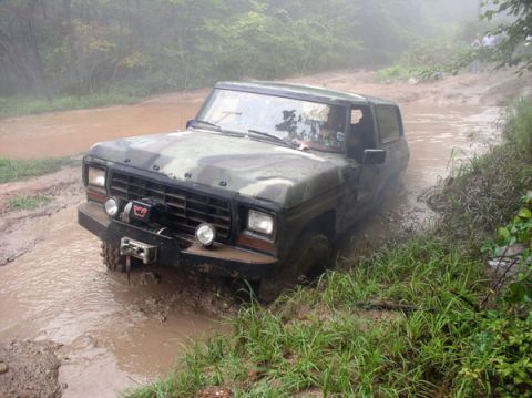 1988 Ford Bronco - This Ford Bronco is navigating a challenging muddy off-road course.
