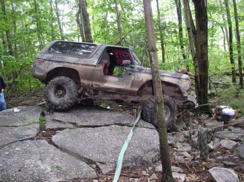 1988 Ford Bronco - This 1978 Ford Bronco navigates a challenging rocky terrain with assistance from a winch strap.