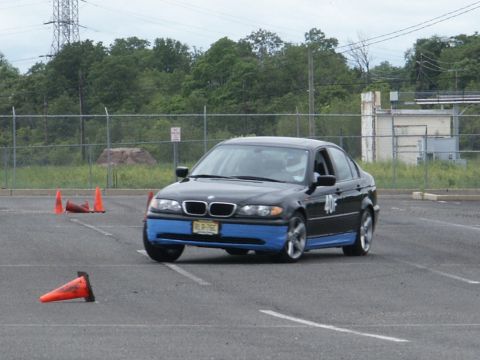 2001 Mercury Grand Marquis - A black sedan with distinctive blue accents navigates a course marked by orange traffic cones.